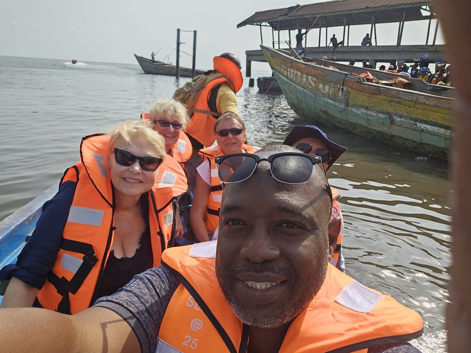 Group of travellers on a guided boat trip in West Africa